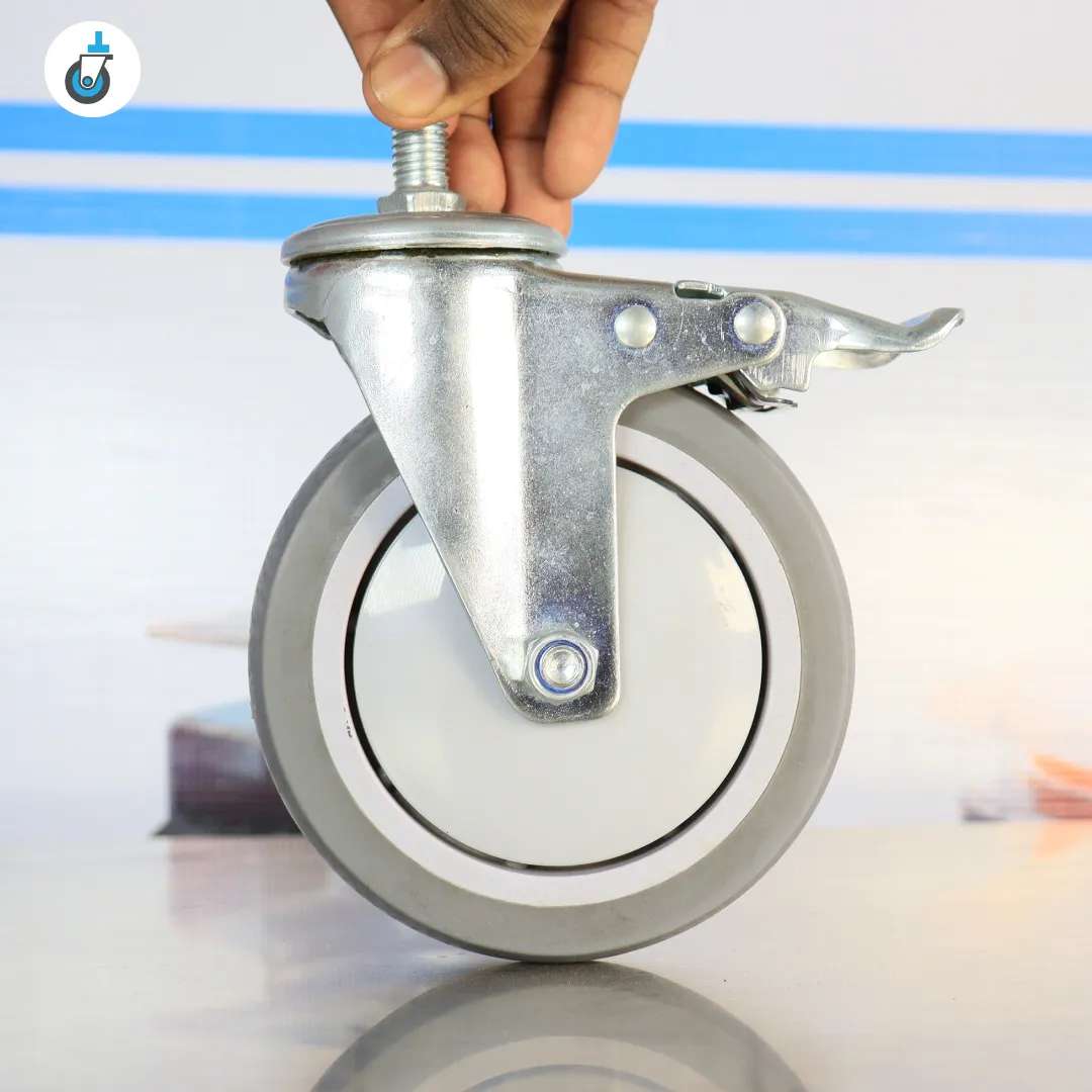 Side profile of the 5-inch swivel caster with brake showing hub bolt and fork geometry.